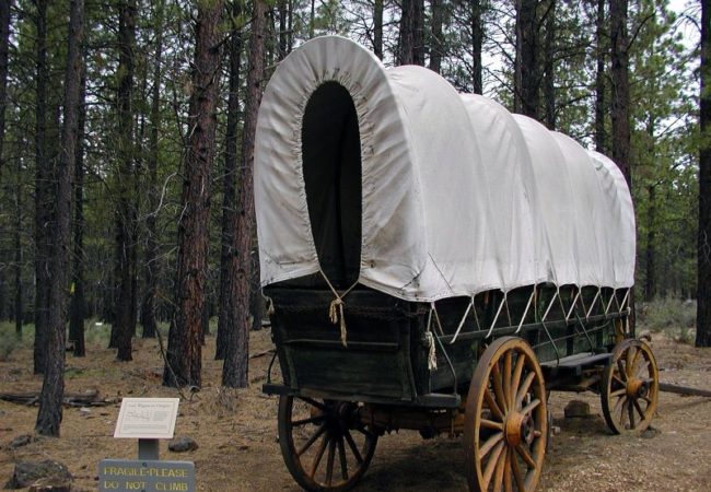 "Covered wagon at the High Desert Museum Outside" flickr photo by B.D.'s world https://flickr.com/photos/bdsworld/24161321 shared under a Creative Commons (BY-SA) license